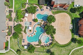 Oversized resort style swimming pool with cascading fountains
